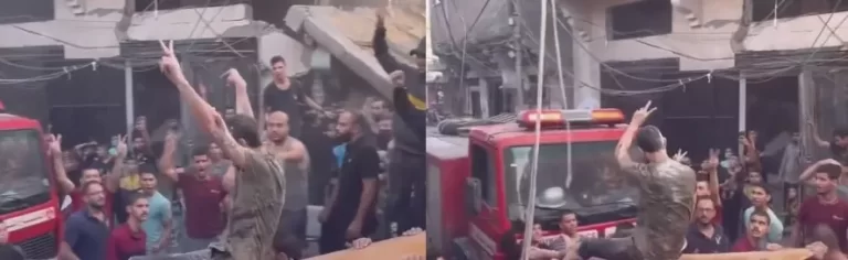 فلسطيني مصاب يرفع علامة النصر بعد إنقاذه من تحت ركام منزله المهدم في غارة إسرائيلية